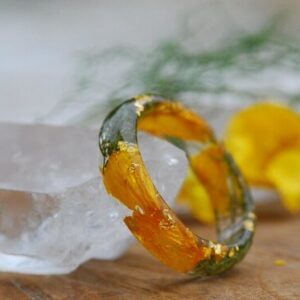 springtime ring with yellow buttercap and green moss