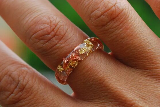 gold copper ring on finger