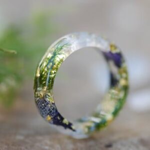 white moonstone ring with purple flower moss and gold
