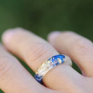 blue white lapis lazuli ring on finger