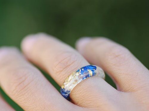 blue white lapis lazuli ring on finger