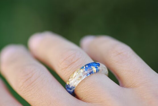 blue white lapis lazuli ring on finger