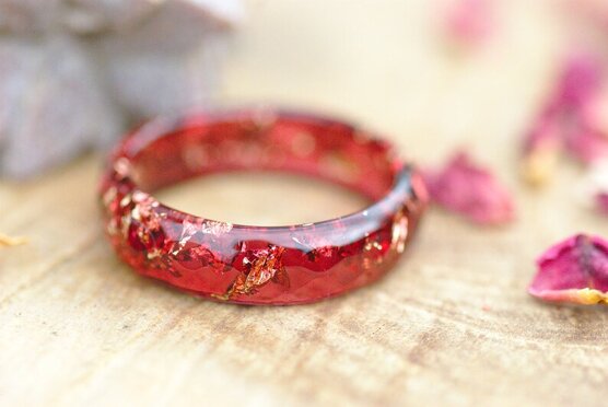 red ring with gold flakes