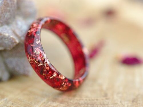 transparent red ring with gold