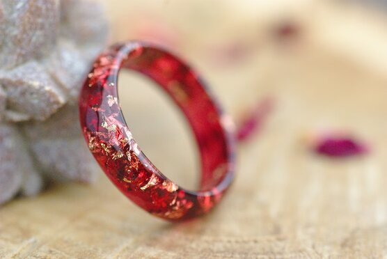 transparent red ring with gold