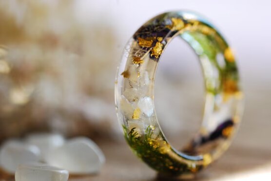 fantastic blend of colors stones and flowers in a resin ring