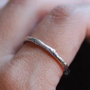 melted silver ring on finger