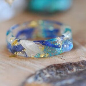 Rainbow moonstone ring with blue and white cornflowers