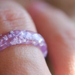 purple lavender colored ring on finger