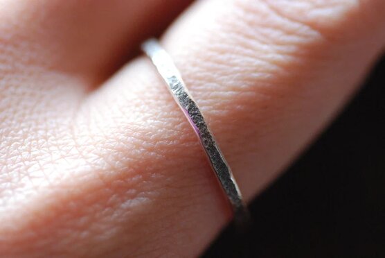rustic tiny sterling silver ring on finger