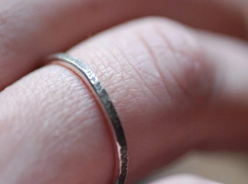 primitive silver ring on finger