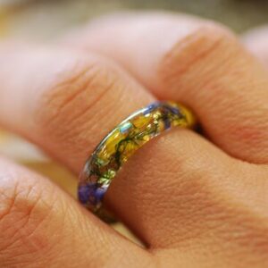 yellow blue summer floral resin ring on finger