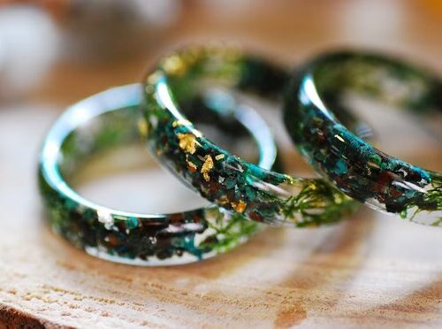 Earthy ring made of chrysocolla and jade gemstones with green moss and metallic flakes