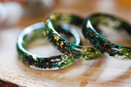 Earthy ring made of chrysocolla and jade gemstones with green moss and metallic flakes