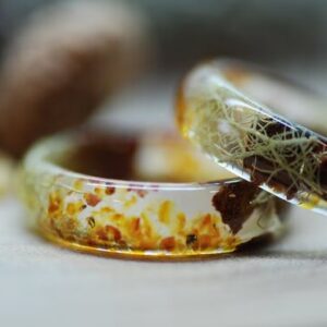 Natural Baltic amber ring with beard lichen and pine cones 