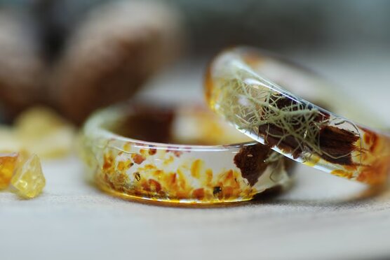 Natural Baltic amber ring with beard lichen and pine cones