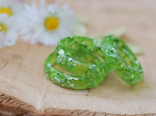 three minimalist light green rings