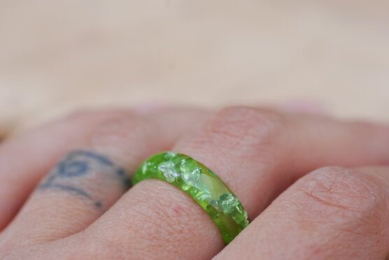 lime green ring on finger