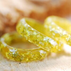 close up of yellow lemon gold resin rings