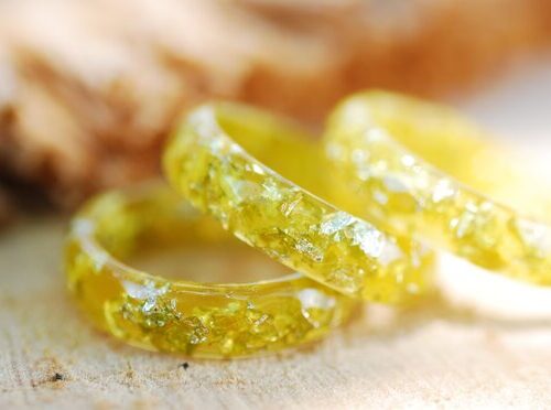 close up of yellow lemon gold resin rings