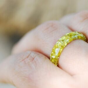 yellow lemon ring on finger