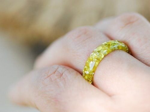 yellow lemon ring on finger