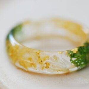 close up of yellow citrine gold and green moss ring