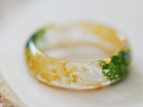 close up of yellow citrine gold and green moss ring