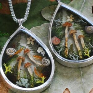 two magic forest necklaces in silver side by side