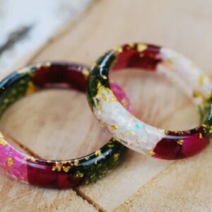 Ring made of resin with pink or white opal, green moss, red roses and gold flakes