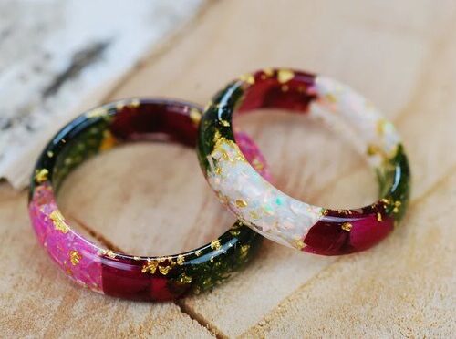 Ring made of resin with pink or white opal, green moss, red roses and gold flakes