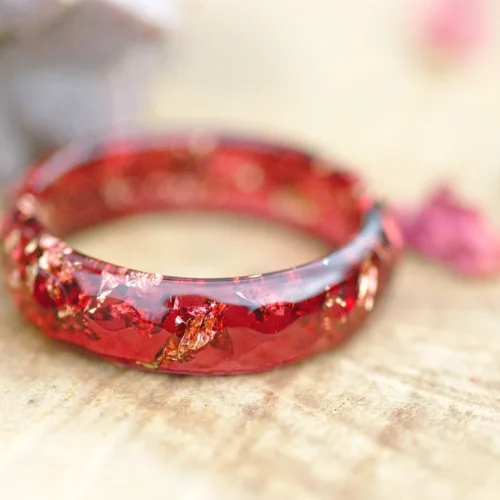 red ring with gold flakes
