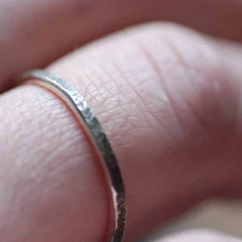 primitive silver ring on finger