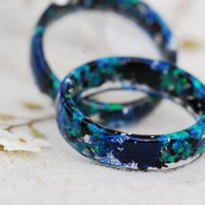 fantastic opal in greenish blue colors in resing ring