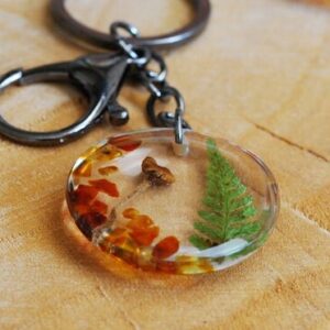 key accessory with mushroom amber and fern