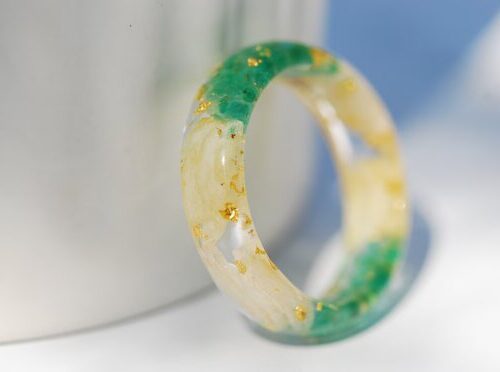 Emerald gold ring with white cornflower and jasmine petals