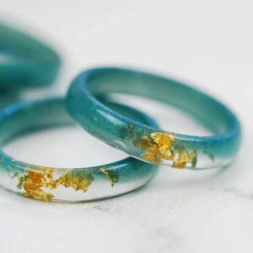 minimalist teal ring in prussia with gold flakes