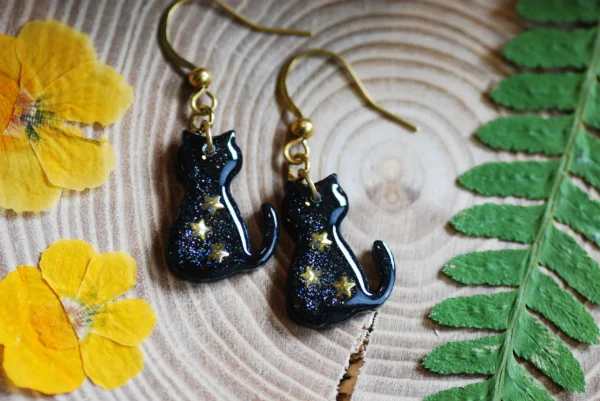 galaxy cat earrings with stars lying flat