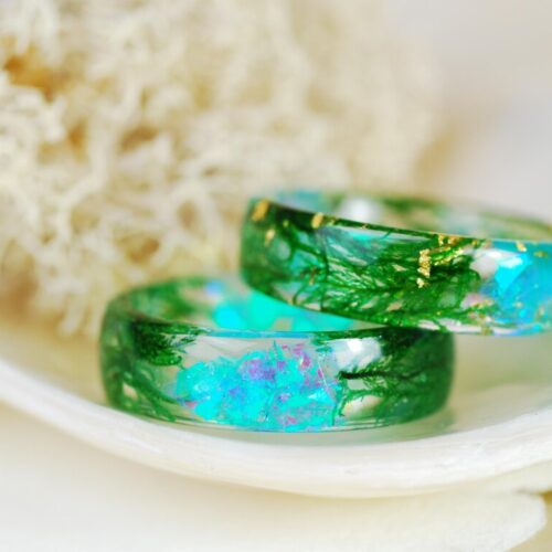 iridescent moss ring on finger