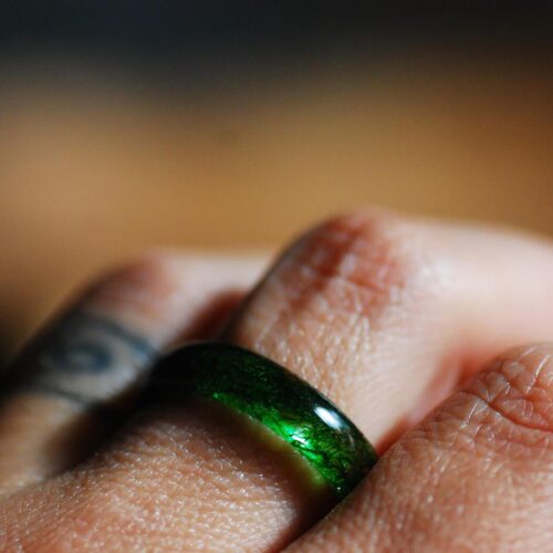 Green moss ring on the finger