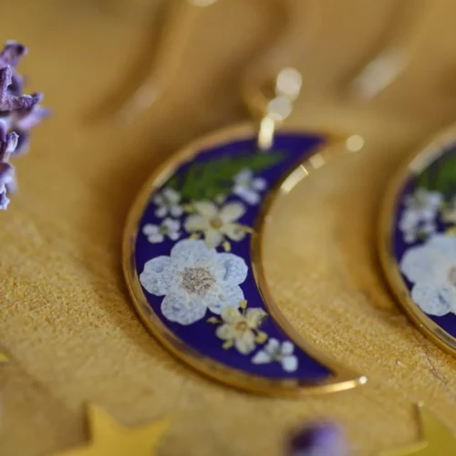 women's purple earrings with flowers