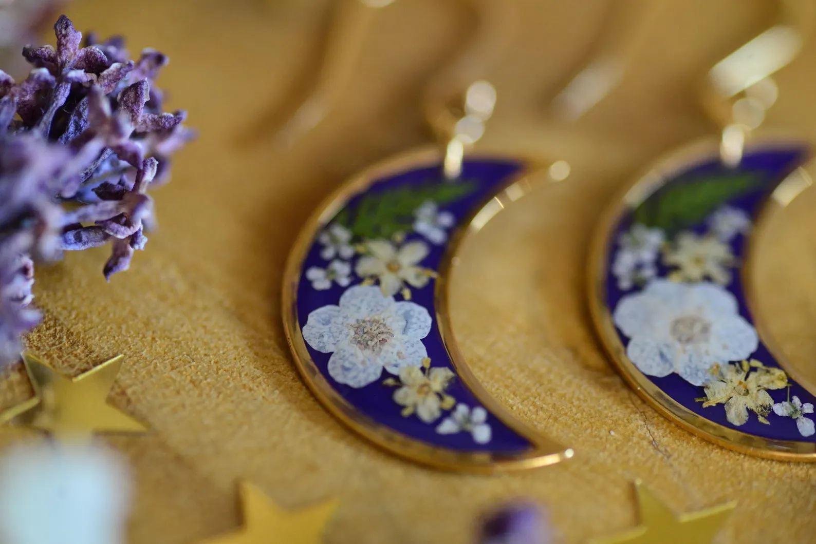 women's purple earrings with flowers