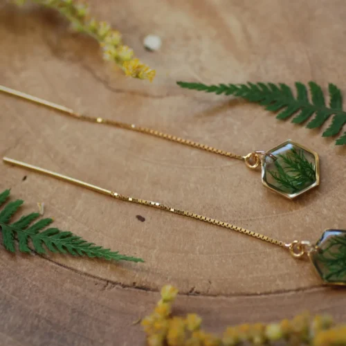 geometric earrings in gold with nature inside