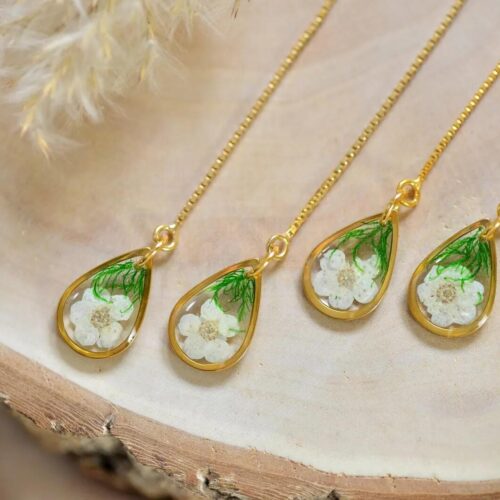 Close‑up of hawthorn flower threader earrings