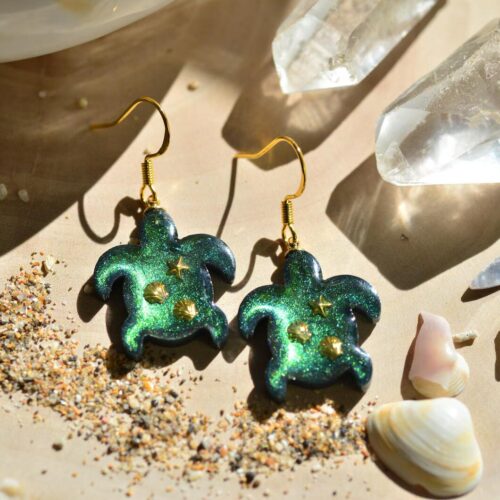 Ocean earrings reflecting green and gold tones