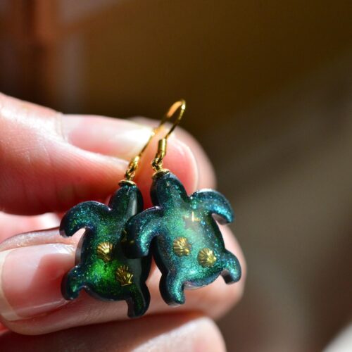 Sea turtle resin earrings handmade by Alpaca Blue in green iridescent resin