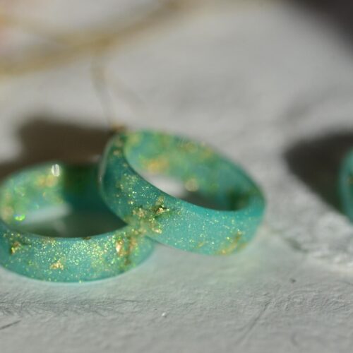 Close‑up of green gold flake resin ring