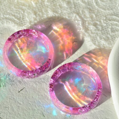 Color shift resin ring showing violet and pink tones