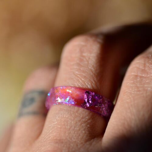 finger wear pink aurora ring