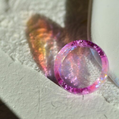 Sparkling light pink aurora resin ring